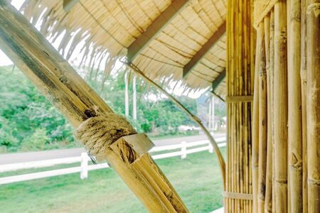 Many bamboo bindings are tied together with hemp ropes to be used as pole for resting cottage....
