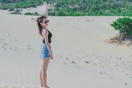 MUI NE, VIETNAM - APRIL 25 : Unidentified tourists relax and take photos on April 25, 2019 at white sand dune desert in Mui Ne, Vietnamのeditorial素材