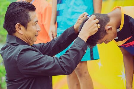 KANCHANABURI THAILAND - AUGUST 2 : The award ceremony of the school's athletic competition medal. on August 2,2018 at WatNongsua School in Kanchanaburi, Thailandのeditorial素材