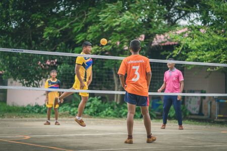 KANCHANABURI THAILAND - JULY 18 :   Unidentified students playing traditional asian sport game sepak takraw on July 18,2018 at Nongthabong School in Kanchanaburi, Thailandのeditorial素材