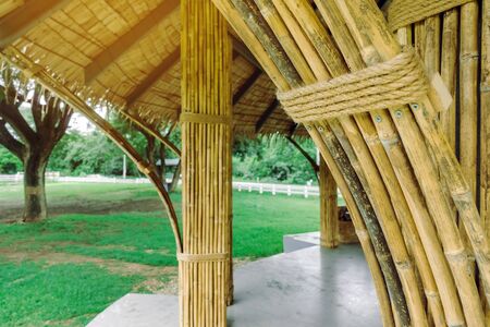 Many bamboo bindings are tied together with hemp ropes to be used as pole for resting cottage. Selective focus on hemp ropes.の写真素材