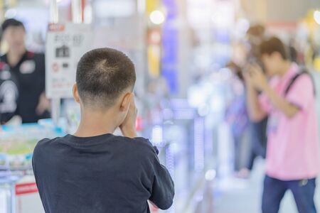 People testing professional photography cameras atTrade show on photography equipment.の写真素材
