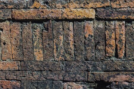 The ancient brick wall was neatly arranged and so strong that there was no space, even a small...