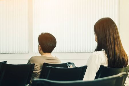 Back view of people sit and waiting in financial transactions in the bank.の写真素材