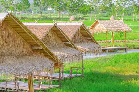 The resting huts constructed from bamboo and thatched roofs for relaxing in the rice fields.の写真素材