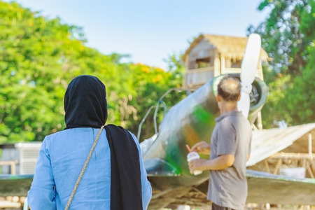 Tourists watch Japanese replica fighter planes during World War II at  World War ll Bridge Project near The Bridge on the River in Kanchanaburi Thailand.のeditorial素材