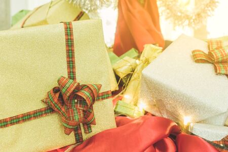 Beautiful various gifts boxes or presents in different size and shape with ribbon on table in the...