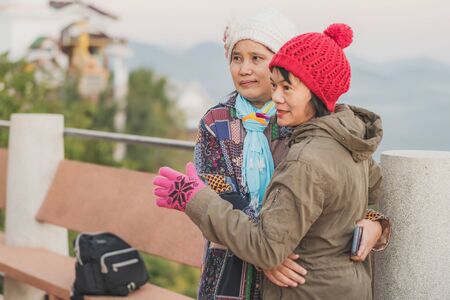 LAMPHUN THAILAND - DECEMBER 9 :  Unidentified tourists taking pictures and selfies while the sunrise...