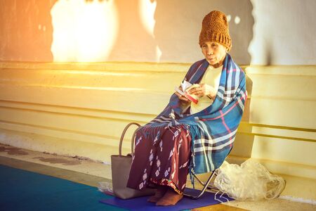 PAGAN-Myanmar, January 21, 2019 : Unidentified people meditate and pray with Buddhist scriptures at...