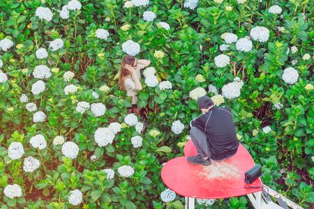 DA LAT, VIETNAM - APRIL 26 : Unidentified lovers happily take pictures and take a selfie among the...