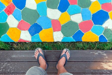 The walkway in the garden are paved with brightly colored stones and have just been cleaned by washing with water.の写真素材