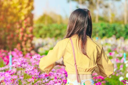 Happiness Tourists take pictures with beautiful blooming flowers in the afternoon at Maple Garden. in Kanchanaburi, Thailand.の写真素材