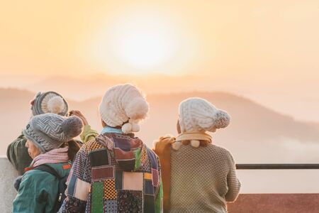 LAMPHUN THAILAND - DECEMBER 9 :  Unidentified tourists taking pictures and selfies while the sunrise on December 9,2019 at Wat Phra Phutthabat Pha Nam in Lamphun, Thailandのeditorial素材
