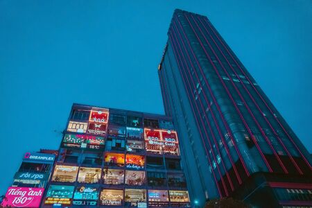 Ho Chi Minh City, Vietnam - April 24, 2019 : The Cafe apartment at night is a new tourist attraction at the city center on April 24, 2019 in Ho Chi Minh City, Vietnam.のeditorial素材