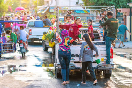 KANCHANABURI, THAILAND - APRIL 17,2019: Unidentified people celebrating Songkran by throwing water to each other on road on April 17, 2019 in Kanchanaburi, Thailand.のeditorial素材
