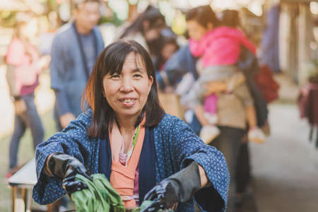 LAMPHUN THAILAND - DECEMBER 12 :  Unidentified Thai female tourists learn to make tie-dye clothes on December 12,2019 at Karen village in Lamphun, Thailandのeditorial素材