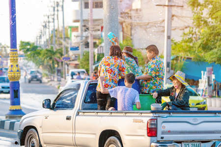 KANCHANABURI, THAILAND - APRIL 17, 2019: Unidentified people celebrating Songkran by throwing water to each other on road on April 17, 2019 in Kanchanaburi, Thailand.のeditorial素材