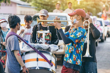 KANCHANABURI, THAILAND - APRIL 17,2019: Jazz music parade of Thai happiness people wearing colorful...