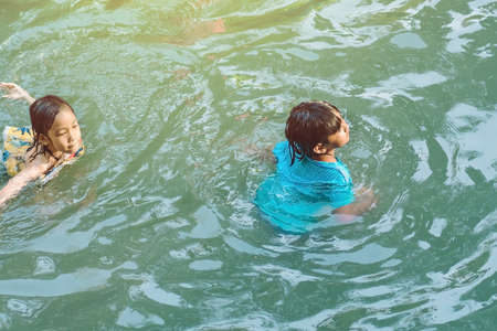 KANCHANABURI, THAILAND - JANUARY 1: Unidentified Asian tourists bathe and soak the body in warm mineral water for good health at Hindad Hotspring on january1, 2020 in Kanchanaburi, Thailand.のeditorial素材