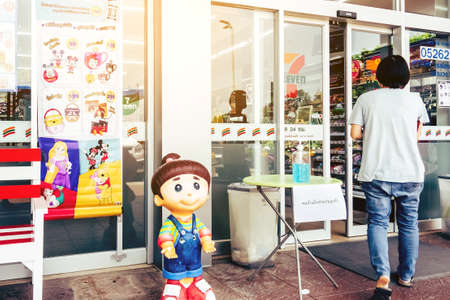 KANCHANABURI THAILAND - MARCH 22 : Coronavirus hand sanitizer gel to wash hands for flu virus prevention for serving customers in front of 7-Eleven convenience store on march 22,2020 in Kanchanaburi, Thailand.のeditorial素材
