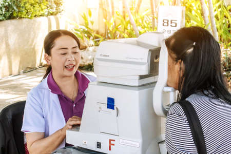 KANCHANABURI THAILAND - DECEMBER 14 : A mobile hospital unit for eye examination services for the general public at public park on December 14,2019 in Kanchanaburi, Thailand.のeditorial素材