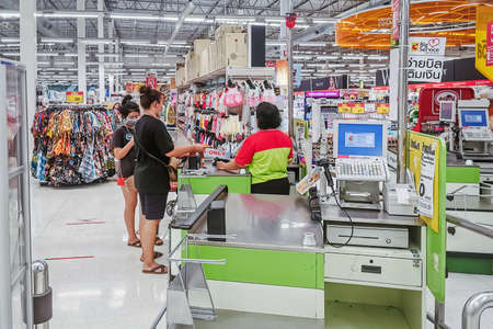 KANCHANABURI, THAILAND - APRIL 11,2020: Unidentified customers wearing face protection in prevention...