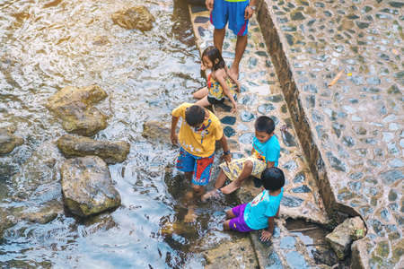KANCHANABURI, THAILAND - JANUARY 1: Unidentified Asian tourists bathe and soak the body in warm mineral water for good health at Hindad Hotspring on january1, 2020 in Kanchanaburi, Thailand.のeditorial素材