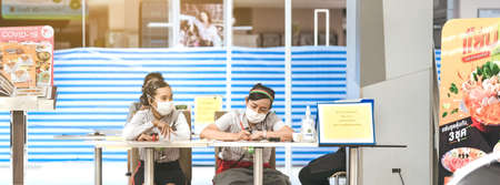 KANCHANABURI/THAILAND-APRIL 18,2020:MK restaurant staffs wait to receive food orders from customers to take home inside of Robinson Department store closes due to the corona virus (Covid-19) outbreak.のeditorial素材