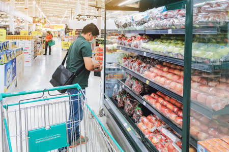 KANCHANABURI, THAILAND - MAY 6,2020: Unidentified Customer wearing face mask protection in prevention for Corona Virus (Covid -2019) and shopping at Lotus Supermarket on May 6,2020のeditorial素材