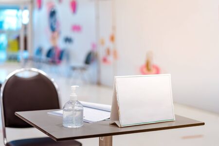 Clear alcohol gel bottles for hand cleaning to prevent the spreading of the corona virus (Covid-19). Place the entrance service with register book for customers before buying in the supermarket.の写真素材