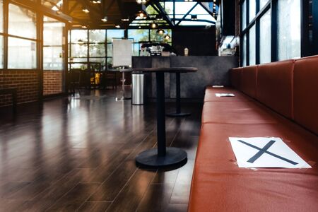 Alternative seating mark for social distance rules in the cafe distance for one seat from other...