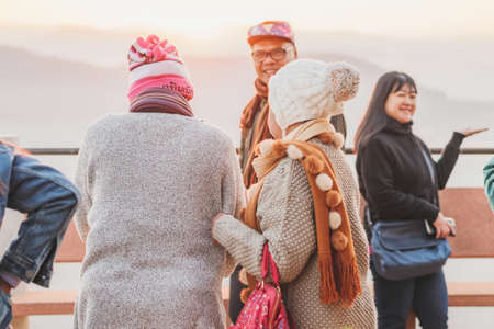 LAMPHUN THAILAND - DECEMBER 9 :  Unidentified tourists taking pictures and selfies while the sunrise on December 9,2019 at Wat Phra Phutthabat Pha Nam in Lamphun, Thailandのeditorial素材