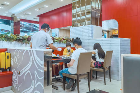 KANCHANABURI,THAILAND-JUNE 21,2020 : Eating with new normal to prevent the spread of the Corona virus (Covid-19) at MK restaurant in Robinson department store on June 21,2020 in Kanchanaburi, Thailandのeditorial素材