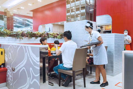 KANCHANABURI,THAILAND-JUNE 21,2020 : Eating with new normal to prevent the spread of the Corona virus (Covid-19) at MK restaurant in Robinson department store on June 21,2020 in Kanchanaburi, Thailandのeditorial素材