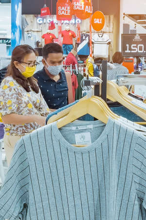 Kanchanaburi, Thailand - JUNE 21, 2020: Unidentified customers wear a protective mask to prevent the Corona virus (Covid-2019) and shopping at the Robinson Department Store.のeditorial素材