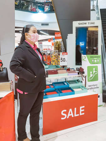 Kanchanaburi, Thailand - June 21,2020: unidentified cashier and customers wear protective masks to protect against coronavirus (Covid-2019) and shopping at the Robinson Department Store.のeditorial素材