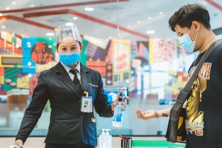 Kanchanaburi,Thailand-JULY 2,2020:Thai students wear various medical masks to prevent themselves from Coronavirus(Covid-19)in time after school and going back home after rain stopped at KTR school.のeditorial素材