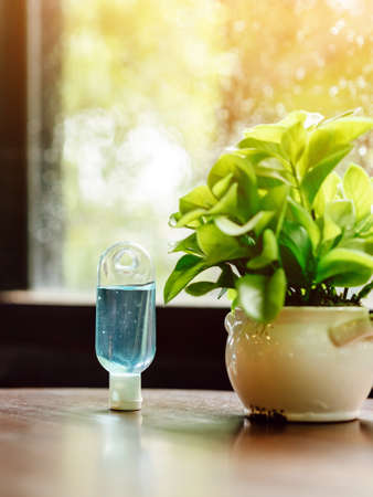 Blue alcohol gel bottle for hand cleaning to prevent the spreading of the Coronavirus (Covid-19),...