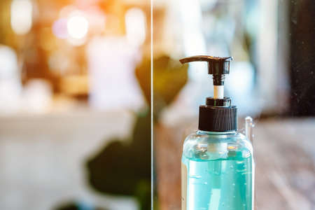 Blue alcohol gel bottle for hand cleaning to prevent the spreading of the Coronavirus (Covid-19),...