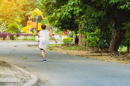 Blue alcohol gel bottle and a register book on the table for athletes to prevent Corona Virus (COVID -19) infection and spread before exercising in public park. New normal lifestyle. Selective focusの写真素材