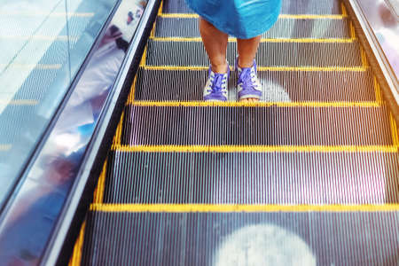 Warning icon white circles symbol on the escalator floor to maintain social distance during the...