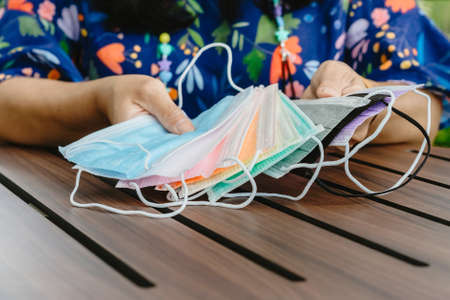Blue alcohol gel bottle and a register book on the table for athletes to prevent Corona Virus (COVID...