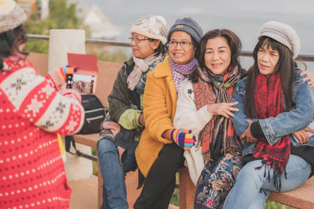 LAMPHUN THAILAND - DECEMBER 9 :  Unidentified tourists taking pictures and selfies while the sunrise on December 9,2019 at Wat Phra Phutthabat Pha Nam in Lamphun, Thailandのeditorial素材