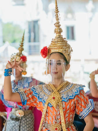 NAKHONPATHOM ,THAILAND-FEBRUARY 14,2021:Traditional Thai dance with protective face shield to prevent CoronaVirus(Covid-19) presented to spirit of PraRaaHoo to reward in return for giving him his wishのeditorial素材