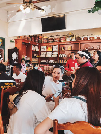 NAKHON SI THAMMARAT,THAILAND-AUGUST 30,2020 : Atmosphere inside the Copee Kafaboran restaurant. It is a famous old Chinese and coffee restaurant which is popular with tourists and locals.のeditorial素材