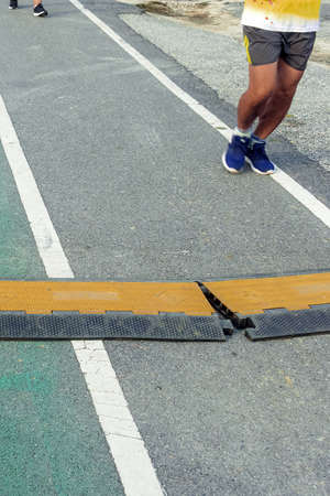 Black and yellow heavy plastic covers for people and vehicle to cross over cables laid on road....