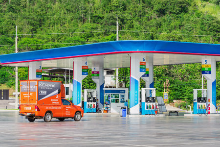 KANCHANABURI,THAILAND-OCTOBER 26,2020 : Kerry express logistic truck on street for speed service to customer on time at PTT gas station. Kerry Express is one of leading delivery services in Thailand.のeditorial素材