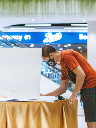 KANCHANABURI,THAILAND-JULY 11,2020:All people wear face mask must register their identity using QR code or registration book before shopping to prevent the spread of Corona virus(Covid-19) at Robinsonのeditorial素材