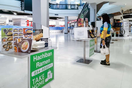 KANCHANABURI, THAILAND - AUGUST 21,2021 : Thai People order food by menu to take home inside of...