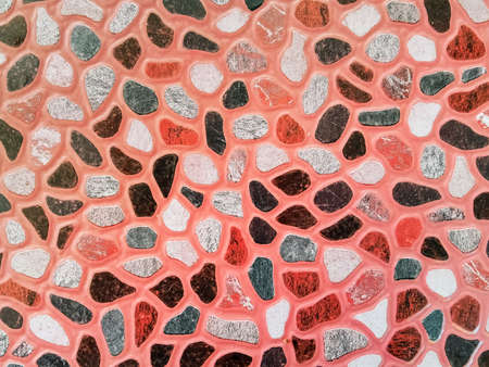 Stone block make an imitation of the real thing with paper to decorate the walls.Texture of a stone wall made from paper recycled. Artificial surface with stone paving that looks like the real thing.の写真素材